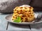 Light vegetable breakfast with zucchini waffles with cheese sauce and basil on a light plate