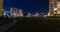Light in windows of multistory building area of urban development residential quarter. Loop night panorama