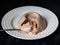 Light yogurt jelly with frozen berries on a glass plate and a teaspoon