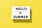 Lightbox message Hello Summer yellow background