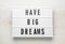 Lightbox with motivational quote Have Big Dreams on white wooden table, top view