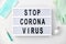 Lightbox with stop coronavirus caution words