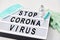 Lightbox with stop coronavirus caution words