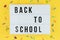 Lightbox with text BACK TO SCHOOL on yellow background