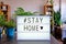 Lightbox written Stay Home with cinema letters.