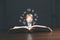 Lightbulb on book with education e-learning icons, Internet education course degree, study knowledge to creative thinking idea and