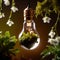 Lightbulb with plants and blooming flowers growing, showing renewable environment friendly energy for electricity