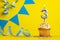 Lighted birthday candle number 3 - Yellow background with blue pennants