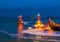 Lighted boats sailing at night in the port of Vlissingen, The pier jetty in the evening, Zeeland, The Netherlands