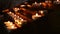 Lighted candles in the temple in the twilight