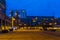 Lighted city street by night with shops and apartment buildings, Tilburg, The Netherlands, 10 December, 2019