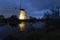 A lighted old-fashioned windmill during a festival in Kinderdijk, Holland