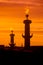 Lighted Rostral columns at sunset. St. Petersburg, Vasilievsky i