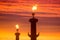 Lighted Rostral columns at sunset. St. Petersburg, Vasilievsky i