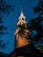 LIghted spire of Memorial Church, Harvard Yard, through summer e