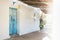 Lightened blue wooden door of abadoned church Ermita de Sant Antoni y Sant Jaume in Cap Blanche, Altea, Spain