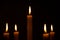 Lightened candles on dark background