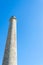 Lighthouse against the blue sky. Bottom view. Travels. Maritime architecture.