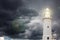 Lighthouse against stormy sky