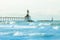 Lighthouse against the waves on Lake Michigan