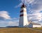 Lighthouse in Alnes, Norway in tranquil warm spring afternoon