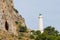 Lighthouse along a hill in the port of Cefalu north of Sicily