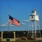 Lighthouse with American Flag