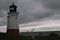 Lighthouse and Anchor on a Stormy Day