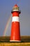 Lighthouse on background of the Rainbow.