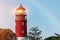 Lighthouse in Baltiysk port. Beautiful rainbow and beacon lights. Clean blue sky, copy space