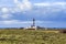 Lighthouse and Beacon of Ouessant, the island of Ushant, in Brittany, french rocky beach in northern France, Finistere