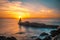 Lighthouse during a beautiful orange sunset in the Pasajes San Juan, Gipuzkoa, Spain