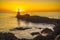 Lighthouse during a beautiful orange sunset in the Pasajes San Juan, Gipuzkoa, Spain