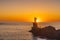 Lighthouse during a beautiful orange sunset in the Pasajes San Juan, Gipuzkoa, Spain