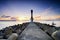 Lighthouse and beautiful sea view scenery over stunning sunrise background