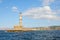 Lighthouse. Beautiful view to the rocky coast with ancient architecture. Seaport touristic town Chania, Creete island, Greece.