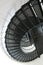 Lighthouse black metal spiral staircase with landing and shadows