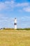 Lighthouse black white on dune