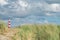 Lighthouse Bornrif Ameland, sea landscape, clear blue cloudy sky in the dunes, high dune grass