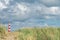 Lighthouse Bornrif Ameland, sea landscape, clear blue cloudy sky in the dunes, high dune grass