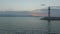 Lighthouse and breakwater with fishing boat moving