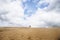 Lighthouse buried in a large sand dune