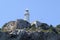 Lighthouse Cabo Nao Cape on rocks mountain