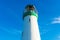 Lighthouse on California Pacific Ocean coast under blue sky at the daytime