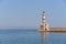 Lighthouse in Chania in Crete with foggy skies in the background.