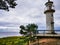 Lighthouse on a cloudy shore