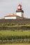 Lighthouse and cornfield in Lajes de Flores, Azores. Portugal