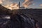 Lighthouse during dawn in a winter day with cloudy sky