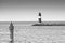 Lighthouse of the eastern pier at Rostock Warnemuende in monochrome