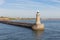 Lighthouse at end of breakwater harbor Newcastle at river Tyne